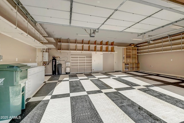 42023 N Bridlewood Way, Anthem, AZ 85086 - garage with a garage door opener, water heater, and baseboards