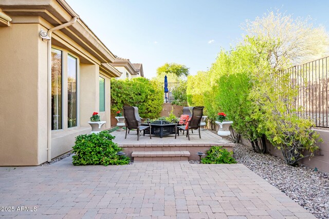 42023 N Bridlewood Way, Anthem, AZ 85086 - view of patio / terrace with a fire pit