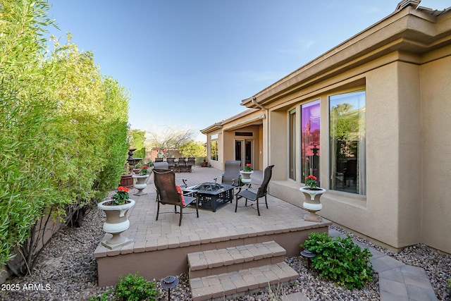 42023 N Bridlewood Way, Anthem, AZ 85086 - view of patio / terrace with an outdoor fire pit