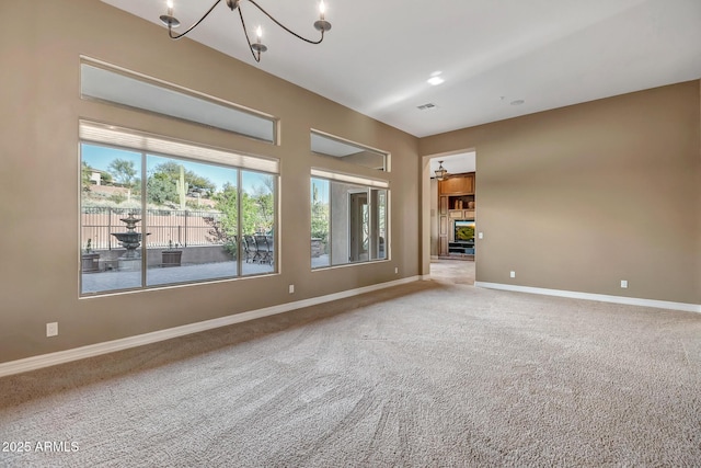42023 N Bridlewood Way, Anthem, AZ 85086 - carpeted empty room with a chandelier and baseboards