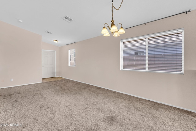 1623 E Maplewood Ave, Buckeye, AZ 85326 - spare room with a chandelier, carpet flooring, and lofted ceiling