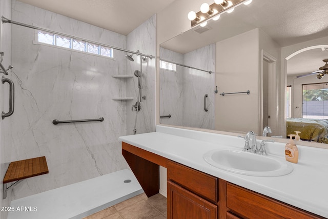 1623 E Maplewood Ave, Buckeye, AZ 85326 - ensuite bathroom with a marble finish shower, vanity, and tile patterned flooring