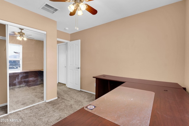 1623 E Maplewood Ave, Buckeye, AZ 85326 - unfurnished bedroom with carpet flooring, a ceiling fan, and a closet