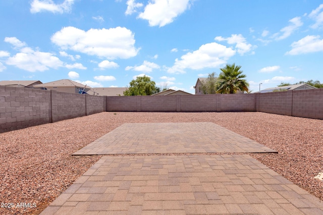 1623 E Maplewood Ave, Buckeye, AZ 85326 - fenced backyard with a patio area
