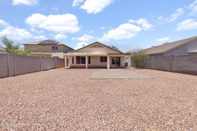 1623 E Maplewood Ave, Buckeye, AZ 85326 - back of property with a fenced backyard and a patio
