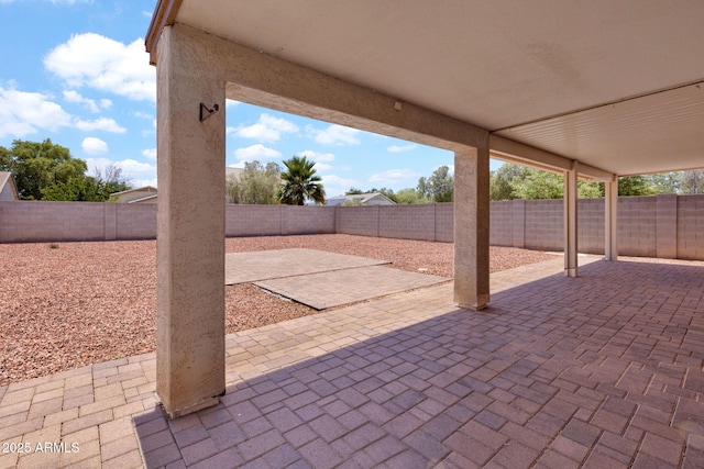 1623 E Maplewood Ave, Buckeye, AZ 85326 - fenced backyard with a patio