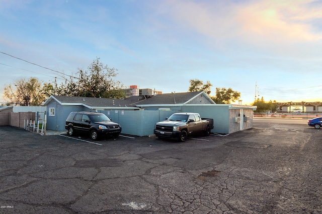 view of parking at dusk