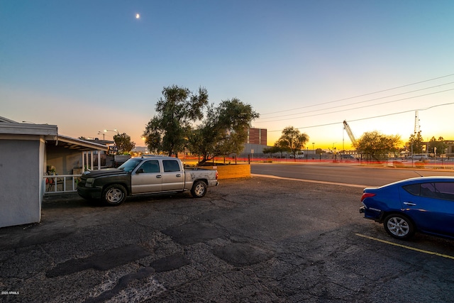 view of parking at dusk