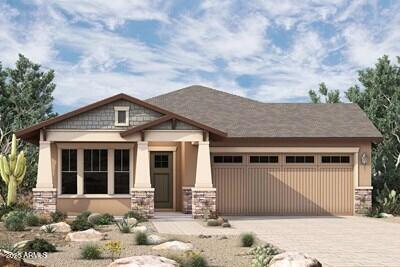 1956 W Rowel Rd, Phoenix, AZ 85085 - craftsman-style home featuring stone siding, decorative driveway, and a garage