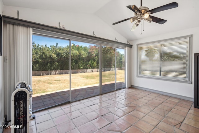 unfurnished sunroom with ceiling fan