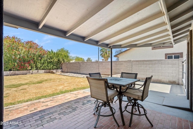 view of patio featuring outdoor dining area and a fenced backyard