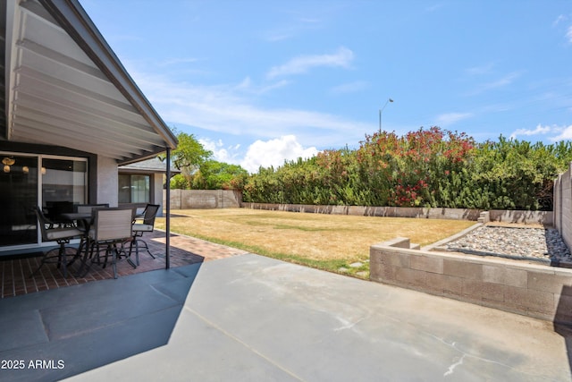 view of patio featuring a fenced backyard and outdoor dining space