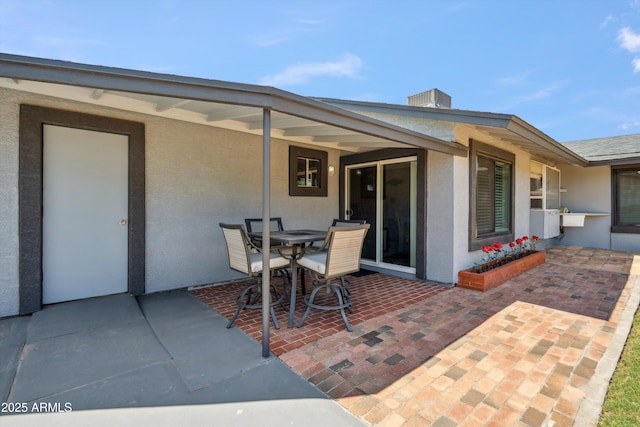 view of patio with outdoor dining area