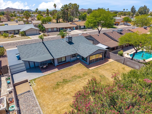 drone / aerial view with a mountain view and a residential view