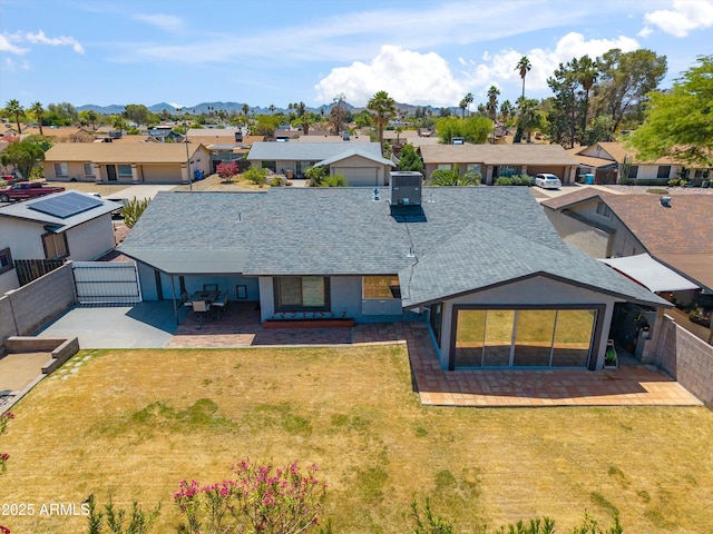 birds eye view of property with a mountain view and a residential view