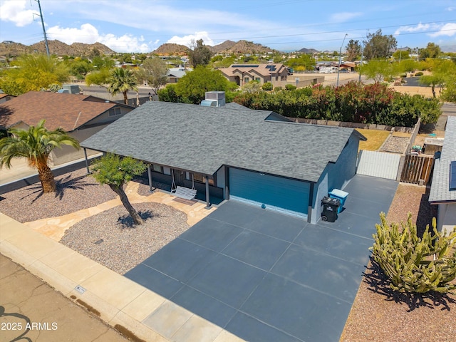 drone / aerial view featuring a mountain view and a residential view
