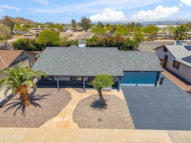 aerial view featuring a mountain view and a residential view