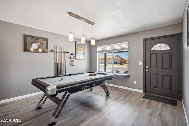 rec room featuring wood finished floors, baseboards, and pool table