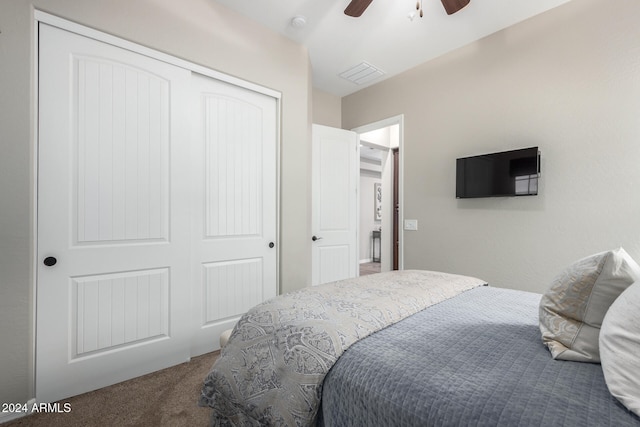 carpeted bedroom with a closet and ceiling fan