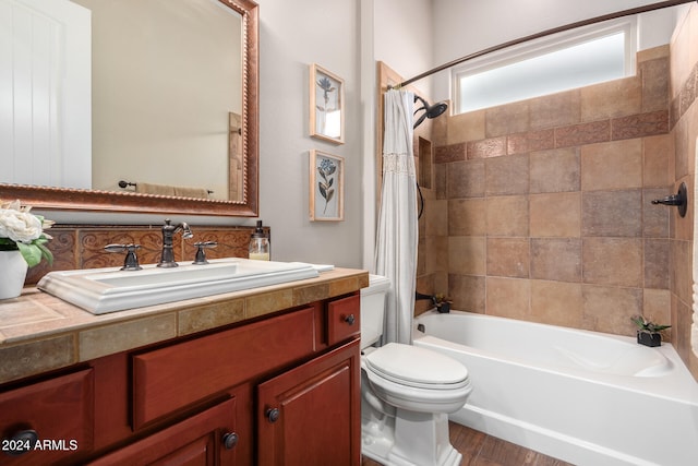 full bathroom featuring vanity, toilet, shower / bathtub combination with curtain, and wood-type flooring