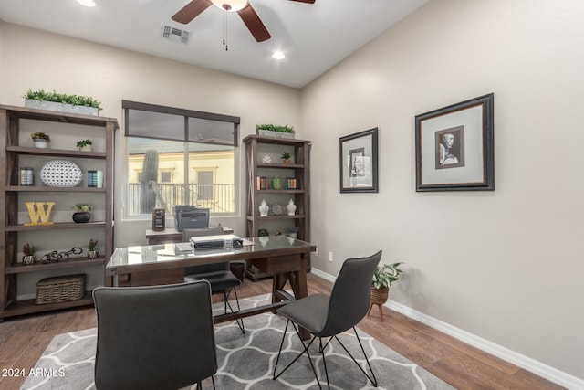 office space featuring dark wood-type flooring and ceiling fan