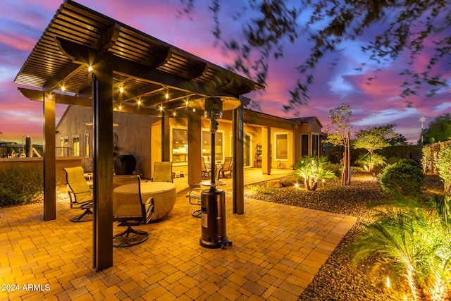 patio terrace at dusk with a pergola