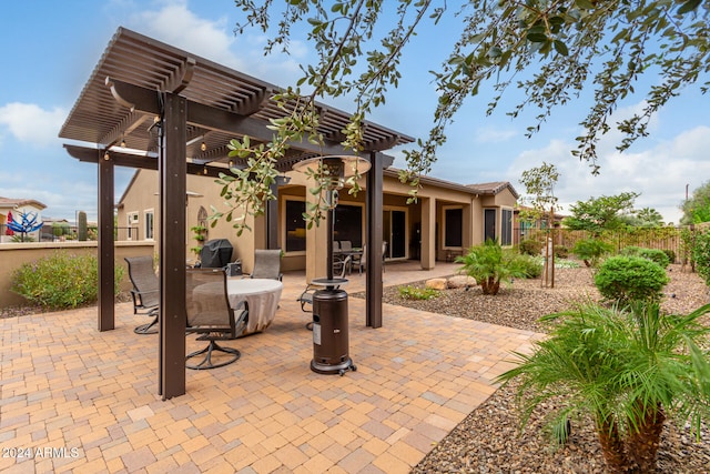 view of patio / terrace featuring a grill and a pergola