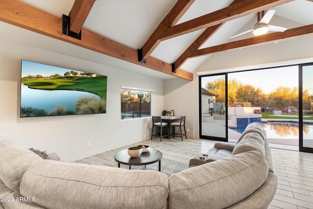 living room with beam ceiling, high vaulted ceiling, and ceiling fan