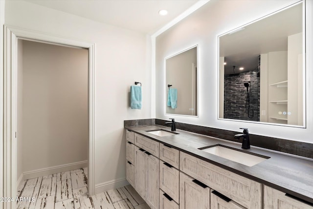 bathroom featuring vanity and a shower with shower door