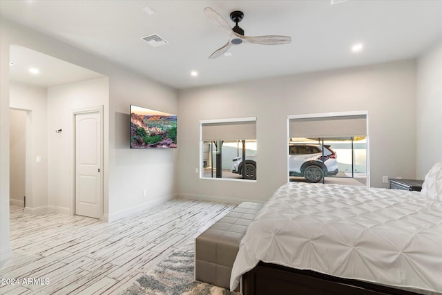 bedroom featuring ceiling fan and light hardwood / wood-style flooring