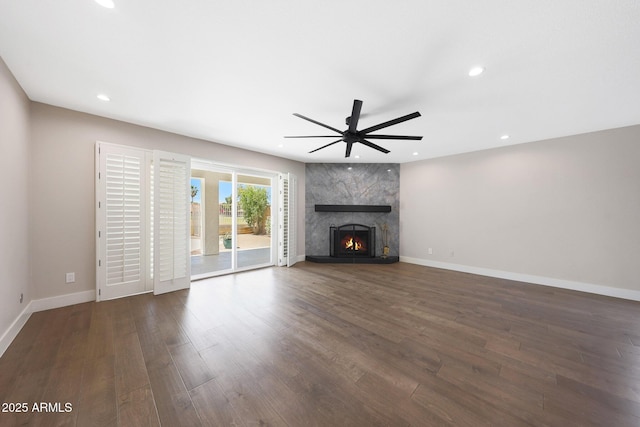 7535 W Kimberly Way, Glendale, AZ 85308 - unfurnished living room with a ceiling fan, dark wood-style floors, a premium fireplace, recessed lighting, and baseboards