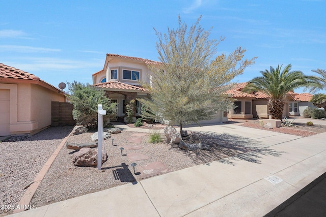 7535 W Kimberly Way, Glendale, AZ 85308 - mediterranean / spanish house with a tiled roof, stucco siding, and driveway