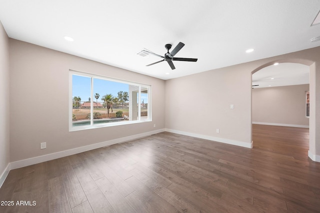 7535 W Kimberly Way, Glendale, AZ 85308 - unfurnished room with arched walkways, a ceiling fan, wood finished floors, recessed lighting, and baseboards