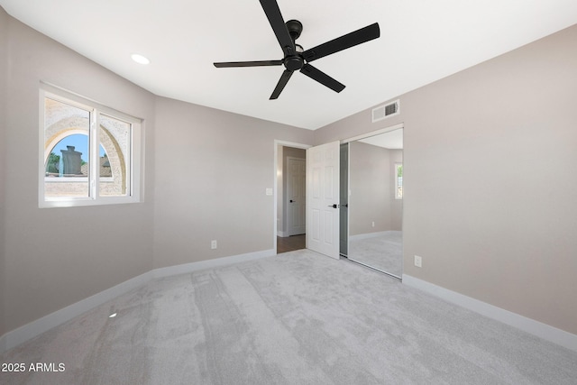 7535 W Kimberly Way, Glendale, AZ 85308 - unfurnished bedroom featuring light carpet, baseboards, a closet, a ceiling fan, and recessed lighting