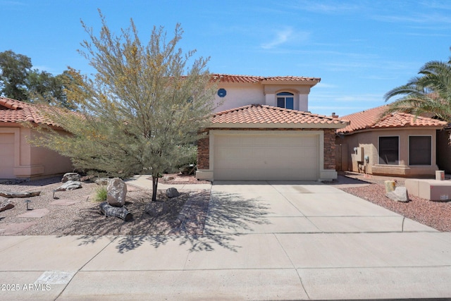 7535 W Kimberly Way, Glendale, AZ 85308 - mediterranean / spanish home with stucco siding, an attached garage, concrete driveway, and a tiled roof