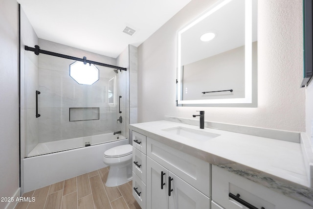 7535 W Kimberly Way, Glendale, AZ 85308 - full bath with vanity, toilet, bathtub / shower combination, and wood finish floors