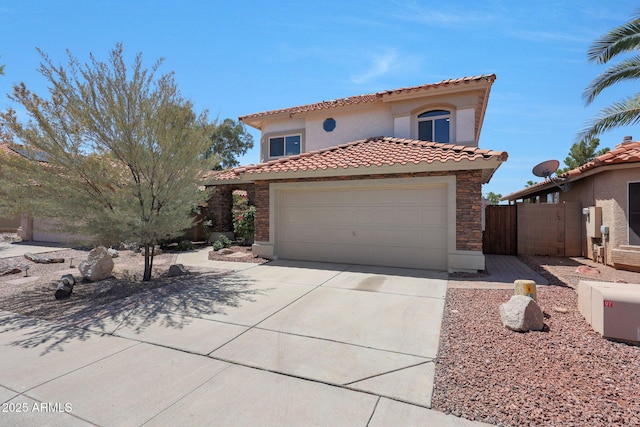 7535 W Kimberly Way, Glendale, AZ 85308 - mediterranean / spanish home featuring a tile roof, driveway, stucco siding, and an attached garage