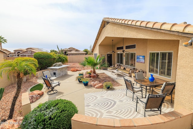 view of patio featuring an outdoor hangout area and ceiling fan