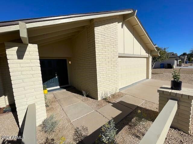 view of side of home featuring a garage