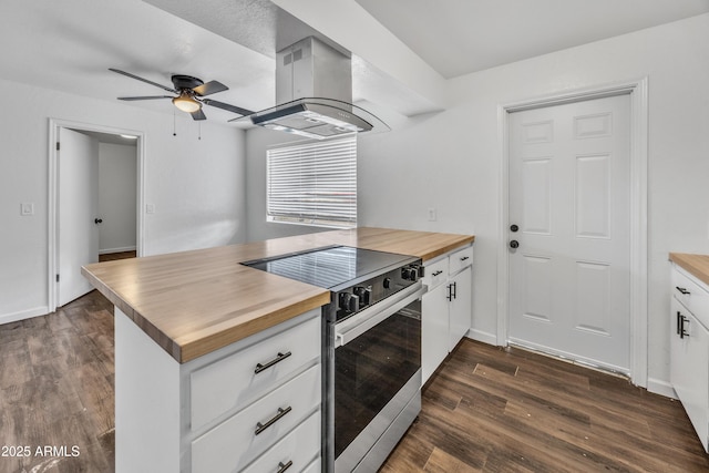 kitchen with ceiling fan, extractor fan, dark wood finished floors, butcher block counters, and electric range