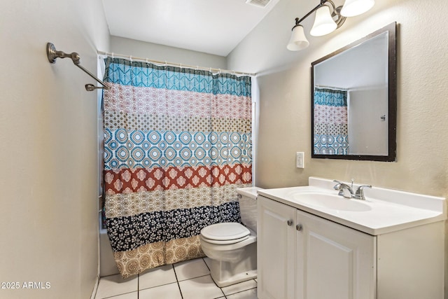 bathroom featuring vanity, tile patterned floors, and toilet