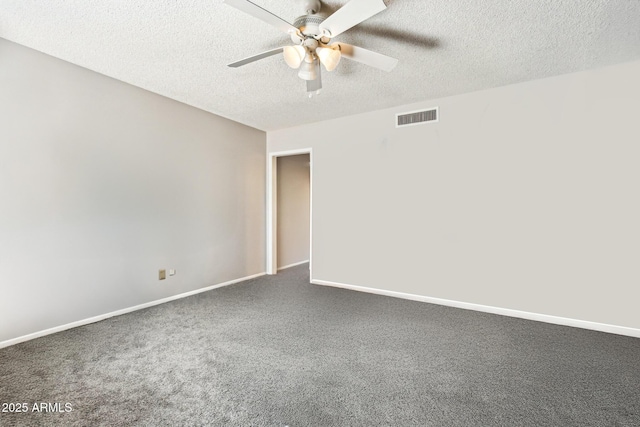 carpeted spare room with a textured ceiling and ceiling fan