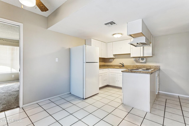 kitchen with white cabinetry, sink, white appliances, and light tile patterned floors