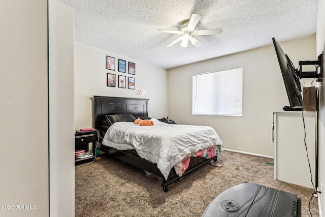 carpeted bedroom with ceiling fan and a textured ceiling