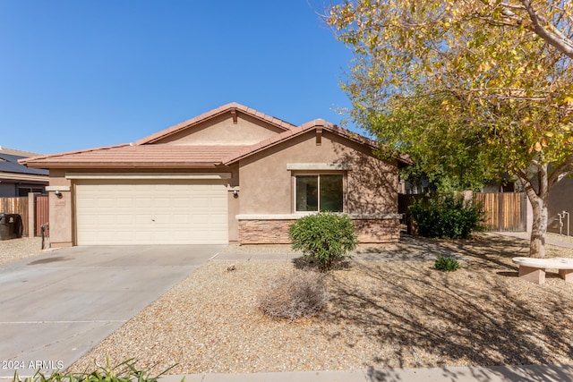 single story home featuring a garage