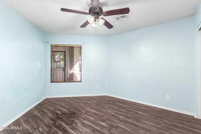 unfurnished room featuring ceiling fan and dark hardwood / wood-style flooring