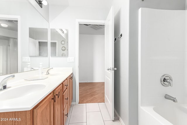 bathroom featuring tile patterned floors, vanity, and bathtub / shower combination