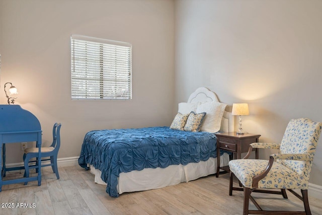 bedroom featuring light wood-type flooring