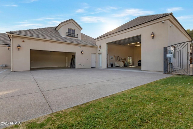 view of front of home with a garage and a front lawn