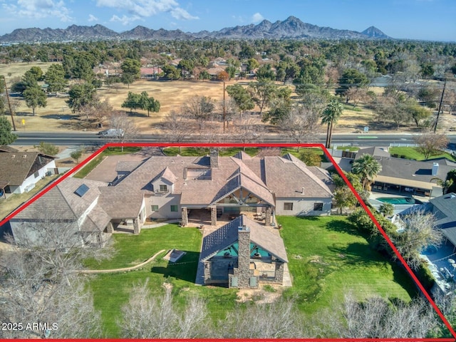 birds eye view of property featuring a mountain view